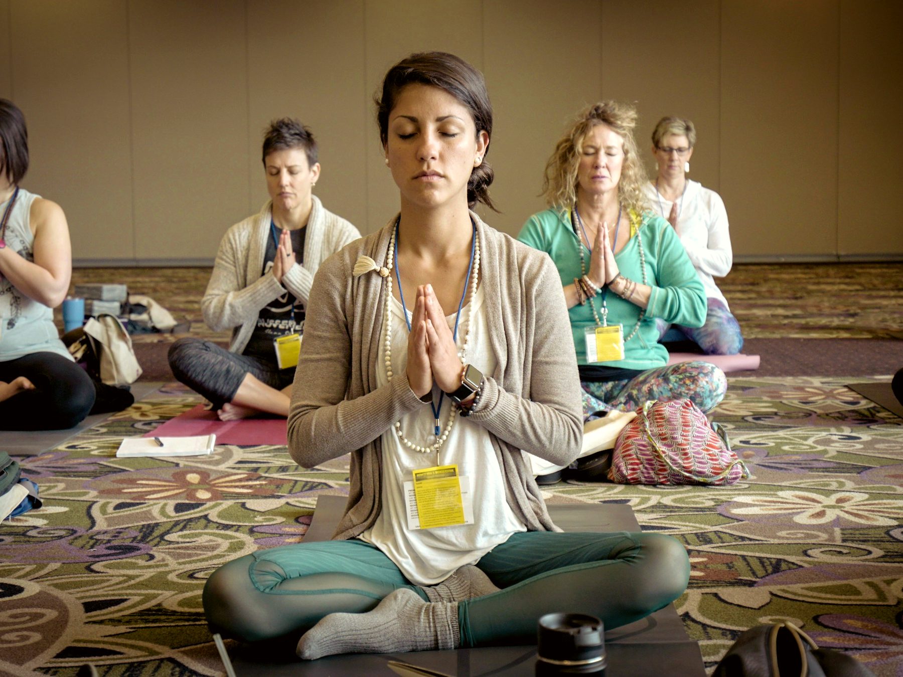 A corporate group in a guided meditation session